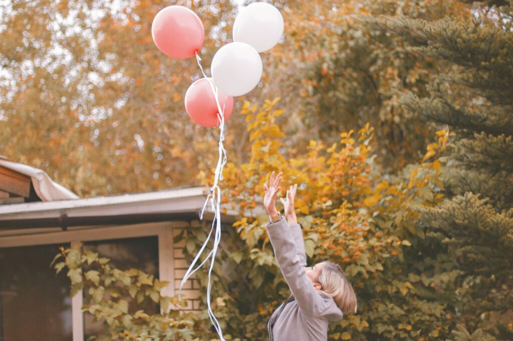 image concept of pretrial release woman releasing balloons