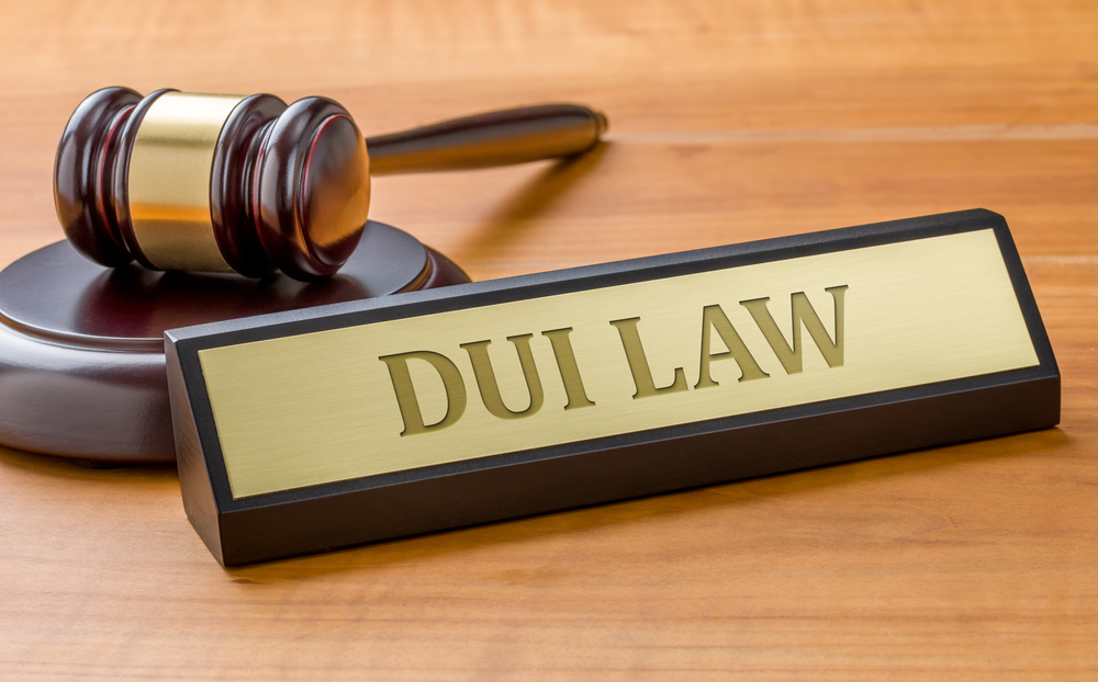 A gavel and a name plate with the engraving DUI Law - Can a DUI be dismissed in Nevada?