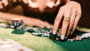 womans hands representing gambling and fraud in las vegas